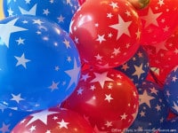 fourthofjulyballoons1 | Ann Albers Visions of Heaven Cluster of red and blue balloons with white stars, creating a festive patriotic display.